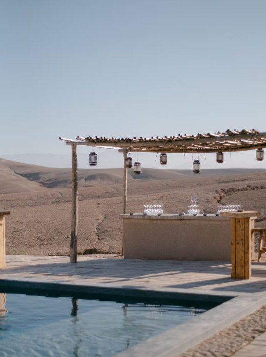 Open-air bar and pool overlooking the Agafay desert near Marrakech